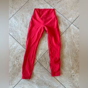 Lululemon leggings, 23” size 4, coral/pink color.